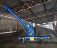 Self-propelled auger grain loader for sale in operation, photo